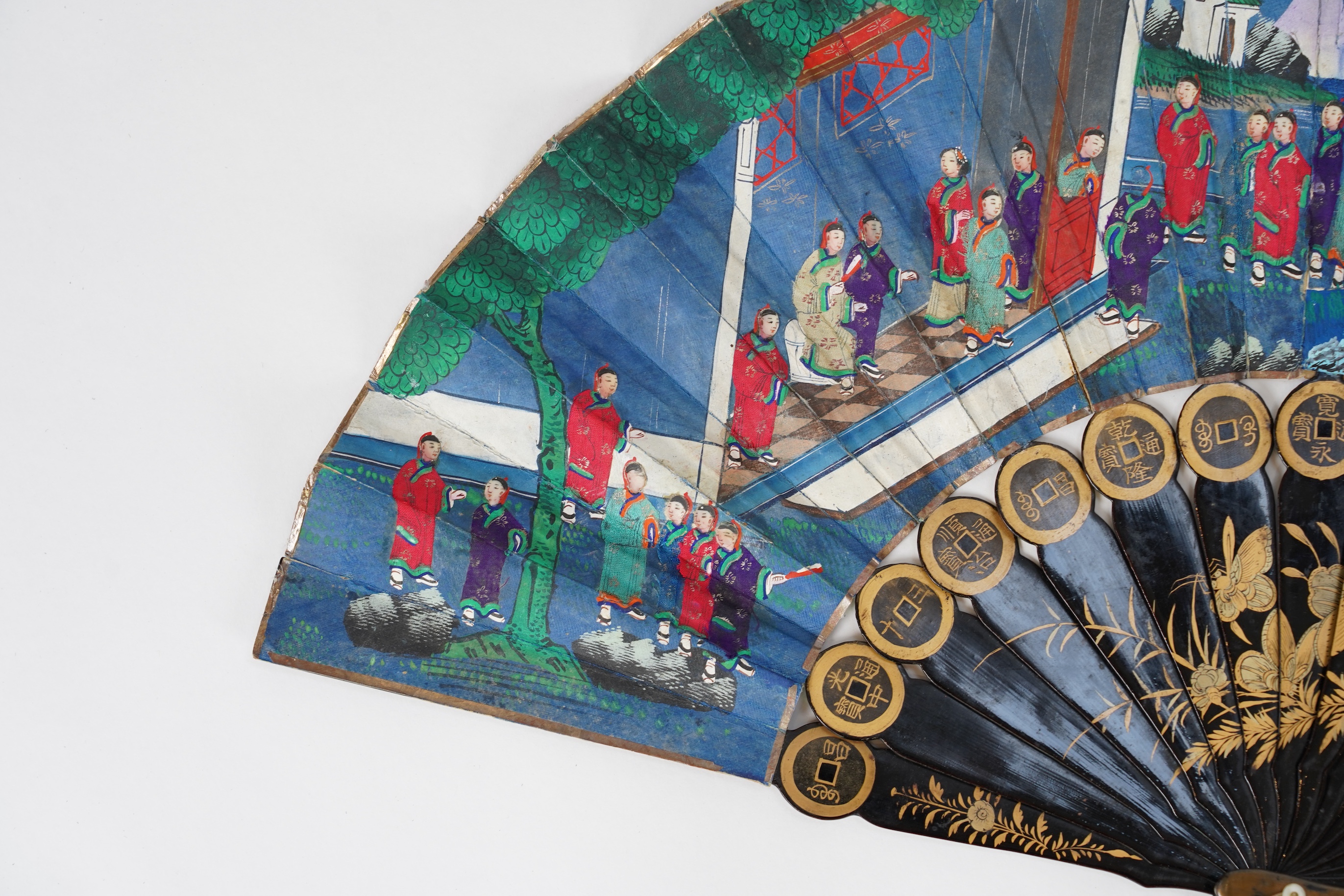 Three Chinese gilt-decorated black lacquer and painted leaf fans, 19th century